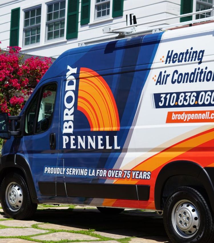 Image of a Brody Pennell service van parked infront of a customers home