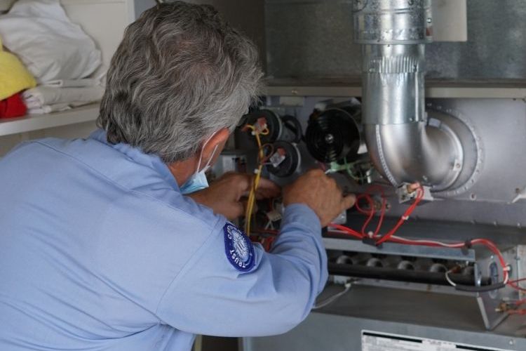 Image of an heater repair specialist in Los Angeles working on a system